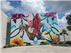 Picture of completed mural with vibrant colors depicting animals and flowers